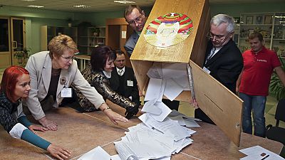 Electoral commission staff count ballot papers after voting closed at a polling station in Minsk, Belarus, on Sept. 23, 2012.