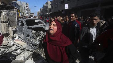 A Palestinian woman reacts after an Israeli strike on Shaheen family house in Rafah, Gaza Strip, Feb. 24, 2024.