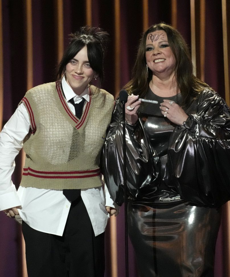 Singer Billie Eilish and actor Melissa McCarthy onstage at the 30th annual SAG Awards in Los Angeles, moments after Eilish signed McCarthy's forehead.