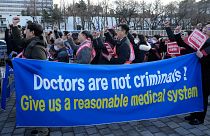 Doctors march toward the presidential office during a rally against the government's medical policy in Seoul, South Korea, February 25, 2024.
