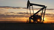 A Whiting Petroleum Co. pumpjack lifts crude oil near Bainville, Montana, US. Nov. 6, 2013.