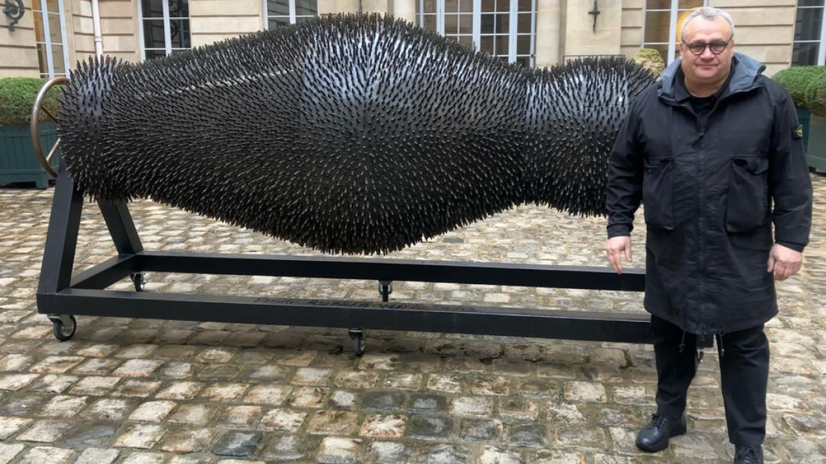 Ukrainian sculptor's haunting artworks made from war debris go on display in Paris thumbnail