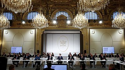 French President Emmanuel Macron, center, delivers a speech at the Elysee Palace in Paris, Monday, Feb. 26, 2024.