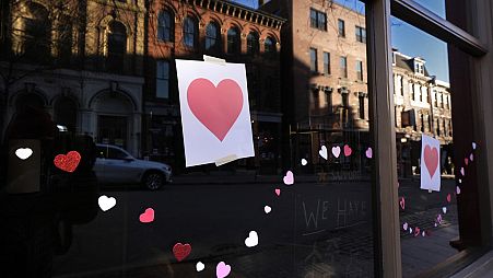 Valentine's Day Hearts decorate a storefront on Exchange Street, Wednesday, Feb. 14, 2024, in Portland, Maine. 