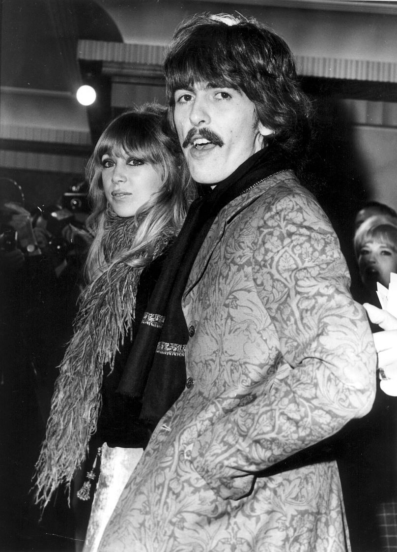Pattie Boyd and then-husband George Harrison attend the 1967 London premiere of "How I won the War" starring Michael Crawford and John Lennon.