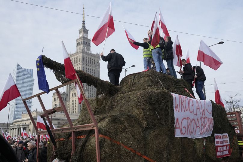 Polish farmers with national flags and angry slogans written on boards, protest against European Union green policies, Warsaw, Poland