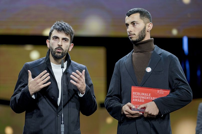 Palestinian Basel Adra (right) and Israeli Yuval Abraham (left) receive the dcoumentary award for "No Other Land"