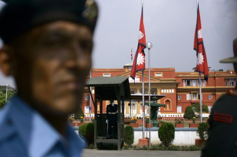 Security personnel stand guard in front of President's Office in Katmandu, May 2009