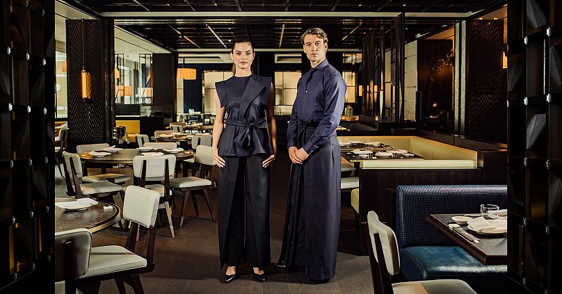 At the Nobu Hotel in London’s Marylebone, the uniforms recall the Japanese heritage of the brand with kimono-style layers and an obi-inspired sash belt.
