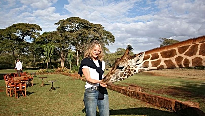 Nicola Shepherd, founder of the Explorations Company, pictured with a giraffe