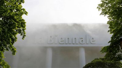 A building with writing Biennale is surrounded by a smoke effect in view of the 58th Biennale of Arts exhibition in Venice, Italy, on 7 May 2019.