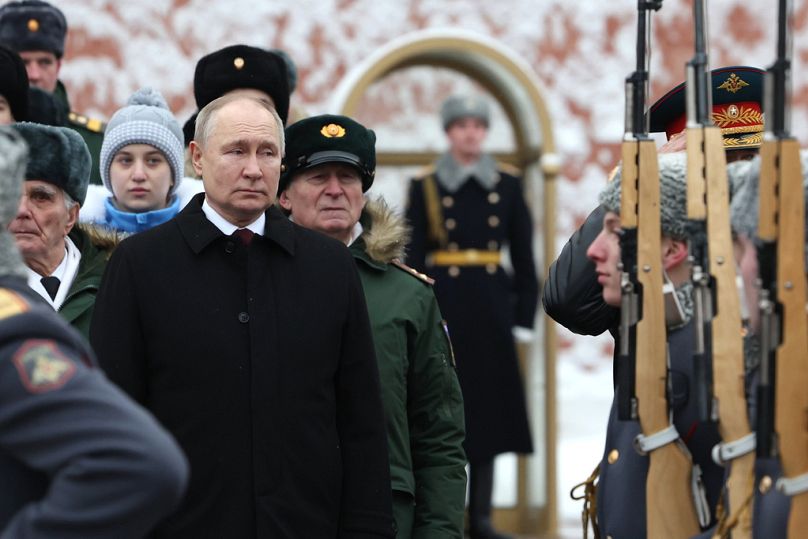 Vladimir Putin takes part in a wreath laying ceremony at the Tomb of the Unknown Soldier in Alexander Garden on Defender of the Fatherland Day.
