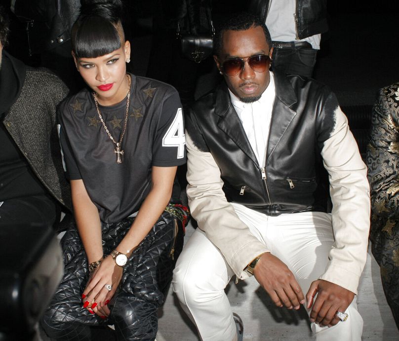 Sean "Diddy" Combs and Cassie attend Kanye West's Women's Fall-Winter 2013 fashion collection presentation at Paris Fashion Week.