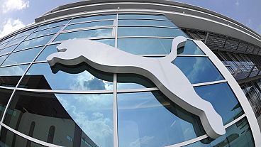 the logo of the German sporting goods producer Puma is pictured on a building at the headquarters in Herzogenaurach, southern Germany, April 20, 2010.