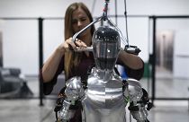 AI engineer Jenna Reher works on humanoid robot Figure 01 at Figure AI's test facility.