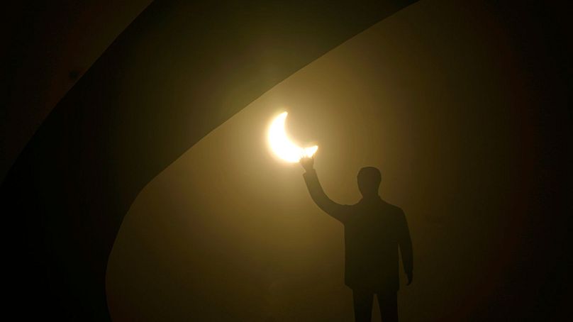 A solar eclipse seen behind the statue of former Brazilian President Juscelino Kubitschek, Brazil, 14 October 2023.