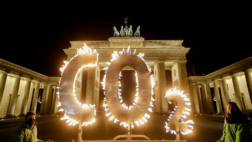 Greenpeace activists stage a climate protest in front of the Brandenburg Gate in Berlin, Germany, May 2021.
