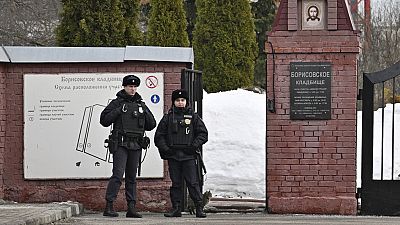 Officers stand guard in front of cemetery where Alexei Navalny will be laid to rest