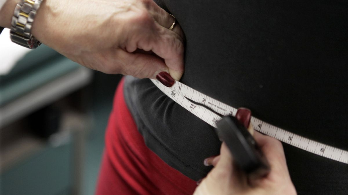 In this Jan. 20, 2010 file photo, a subject's waist is measured during an obesity prevention study in Chicago. 