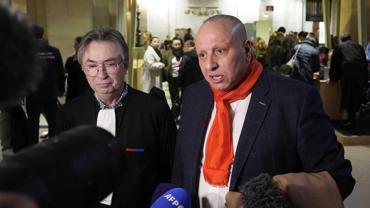 Taxi driver Mostafa Salhane, right, answers journalists with his lawyer Claude Lienard at the Paris' courthouse for the Strasbourg Attack Trial, in Paris, Feb. 29, 2024