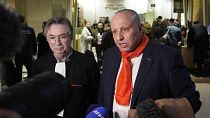 Taxi driver Mostafa Salhane, right, answers journalists with his lawyer Claude Lienard at the Paris' courthouse for the Strasbourg Attack Trial, in Paris, Thursday, Feb. 29, 2