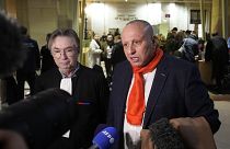 Taxi driver Mostafa Salhane, right, answers journalists with his lawyer Claude Lienard at the Paris' courthouse for the Strasbourg Attack Trial, in Paris, Thursday, Feb. 29, 2