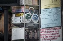 Containers of Zyn, a Phillip Morris smokeless nicotine pouch, is stacked for sale at a newsstand.
