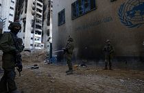 Israeli soldiers take position as they enter the UNRWA headquarters in Gaza, Thursday, Feb. 8, 2024.