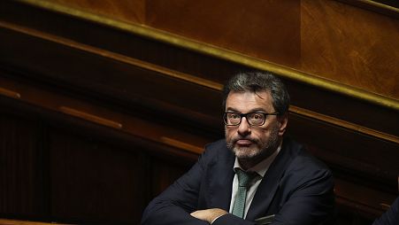 Italian Finance Minister Giancarlo Giorgetti waits for the start of a confidence vote for the new Government, in Rome, Wednesday, Oct. 26, 2022. 