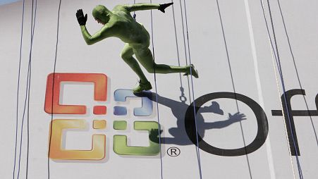 A dancers scales the wall of a New York building to promote the launch of the long-awaited Vista operating system from Microsoft on Monday, Jan. 29, 2007 in New York