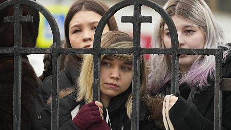 People gather outside the Church of the Icon of the Mother of God Soothe My Sorrows, in Moscow, Russia, Friday, March 1, 2024.