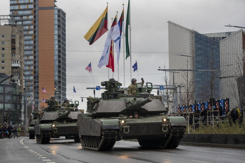 Members of the US Army with Abrams travel during the military parade to celebrate the 105th anniversary of the Lithuanian military, 2023
