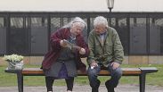 Two old people in a bench