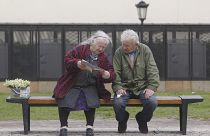 Two old people in a bench