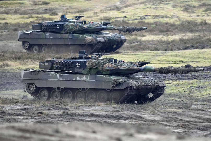 FILE - Two Leopard 2 tanks are seen in action during a visit of German Defense Minister Boris Pistorius in Augustdorf, Germany, Wednesday, Feb. 1, 2023.
