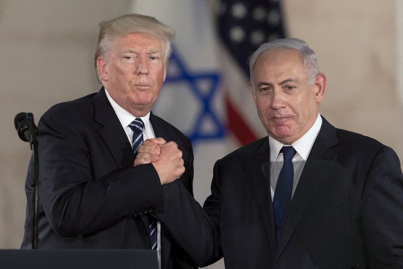 FILE – Then-U.S. President Donald Trump and Israeli Prime Minister Benjamin Netanyahu shake hands at the Israel museum in Jerusalem, Tuesday, May 23, 2017.
