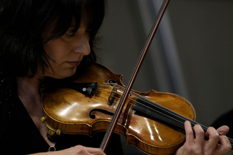 Marissa Regni, Principal Second Violinist of the NSO, plays a rare 17th and 18th-century Italian violin backstage at Milan's La Scala theatre on 26 February 2024.