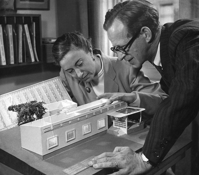 Jane Drew and Maxwell Fry with a model of one of their many buildings for the Gold Coast, 1945.