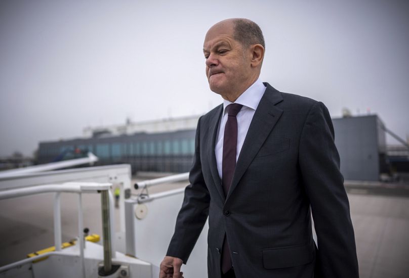 Olaf Scholz boards an Air Force plane at the military section of Berlin Brandenburg Airport.