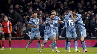 Aston Villa's Lucas Digne, right, is congratulated by his team mates after scoring his sides third goal in a match between Luton Town and Aston Villa, Saturday, March 2, 2024.