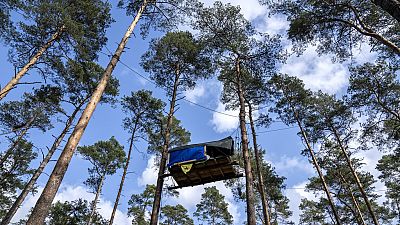 A view of tree houses set up by activists near the Tesla Gigafactory for electric cars in Gruenheide near Berlin, Germany, Tuesday, March 5, 2024.