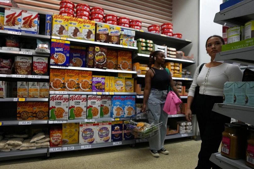 Shoppers buy food in a supermarket in London, August 2022
