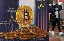  An advertisement for Bitcoin cryptocurrency is displayed on a street in Hong Kong, on Feb. 17, 2022. 