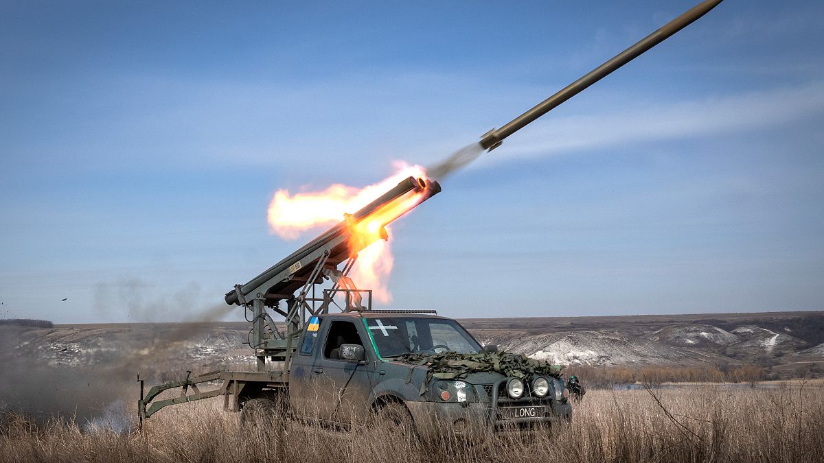 A multiple launch rocket system based on a pickup truck fires towards Russian positions at the front line, near Bakhmut, Donetsk region, Ukraine, Tuesday, March 5, 2024. 
