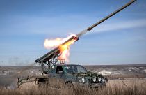 A multiple launch rocket system based on a pickup truck fires towards Russian positions at the front line, near Bakhmut, Donetsk region, Ukraine, Tuesday, March 5, 2024. 