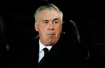 Real Madrid's head coach Carlo Ancelotti takes his seat on the bench ahead of the La Liga soccer match between Valencia and Real Madrid.