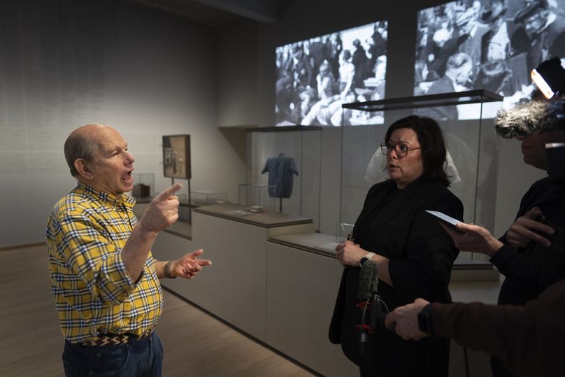 Flip Delmonte, left, a Holocaust survivor, is interviewed with the help of sign language translator Melanie Mol, right, at the new Holocaust Museum in Amsterdam