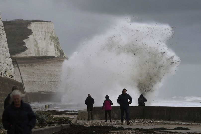 Waves crash over the harbour wall in Newhaven, southern England, Thursday, Nov. 2, 2023.