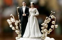 Leann and Bob Adams' bride and groom figurines on top of their 50-year-old wedding cake top photographed in their home Friday morning 