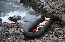 FILE - A dinghy lies on the shore after a shipwreck where two migrants were killed and eight were rescued, in Thermi, on the northeastern Aegean Sea island of Lesbos, Greece